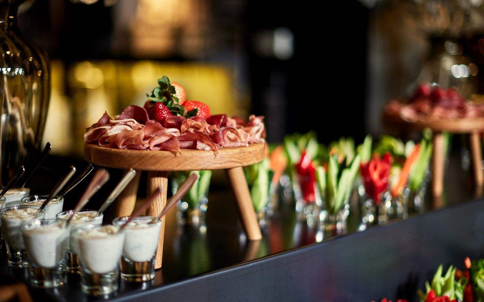 A buffet table with various food and drinks